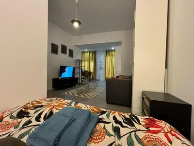 Un ou plusieurs lits dans un hébergement de l'établissement Le Salon Doré Apartment