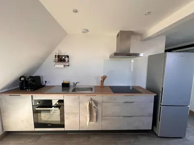 Cuisine ou kitchenette dans l'établissement Le 9 de fer
