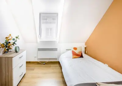 Un ou plusieurs lits dans un hébergement de l'établissement Sienna - Calme et bien-être au coeur de Mulhouse