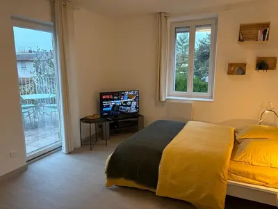 Un ou plusieurs lits dans un hébergement de l'établissement Le Nid de Louise, studio Mulhouse avec terrasse