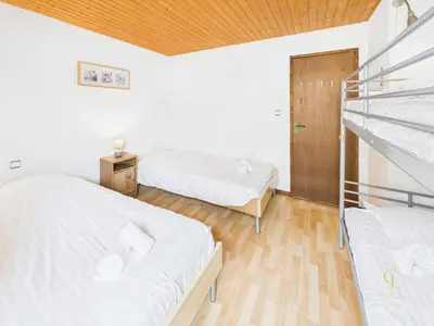 Un ou plusieurs lits dans un hébergement de l'établissement Appartement Terrasse, vue sur les montagnes et Parking