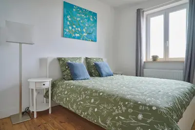 Un ou plusieurs lits dans un hébergement de l'établissement Lovely 2 bedrooms flat Basel Saint Louis -with private parking