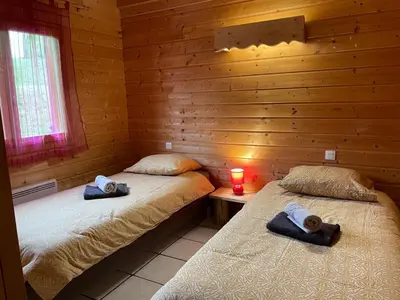 Un ou plusieurs lits dans un hébergement de l'établissement Chalet de montagne à La Bresse, proche des pistes de ski et des lacs