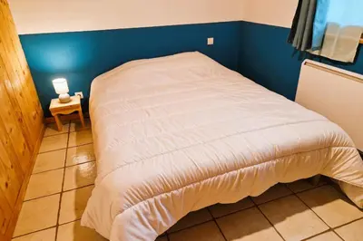 Un ou plusieurs lits dans un hébergement de l'établissement Chalet de montagne à La Bresse, proche des pistes de ski et des lacs