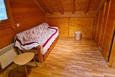 Un ou plusieurs lits dans un hébergement de l'établissement Chalet de montagne à La Bresse, proche des pistes de ski et des lacs