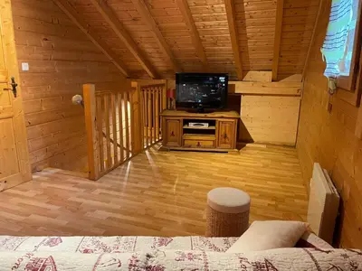 Télévision ou salle de divertissement dans l'établissement Chalet de montagne à La Bresse, proche des pistes de ski et des lacs