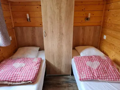 Un ou plusieurs lits dans un hébergement de l'établissement Chalet Bellevue