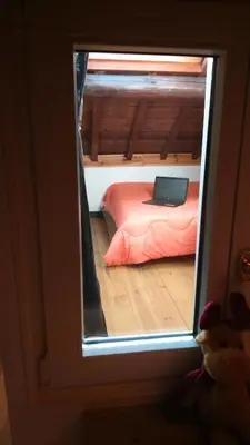 Un ou plusieurs lits dans un hébergement de l'établissement Chalet spa sauna hammam la jonquille