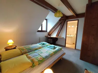 Un ou plusieurs lits dans un hébergement de l'établissement B&B Gite les Baudy