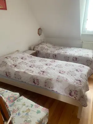 Un ou plusieurs lits dans un hébergement de l'établissement Gîte rose