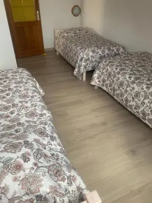 Un ou plusieurs lits dans un hébergement de l'établissement Gîte rose