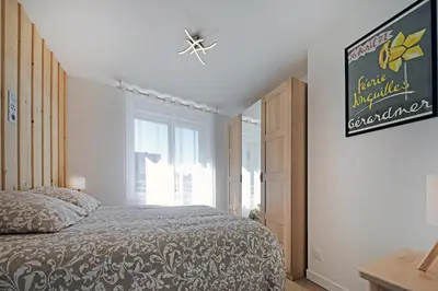 Un ou plusieurs lits dans un hébergement de l'établissement Le Manalac votre Appartement 4-6P au centre ville