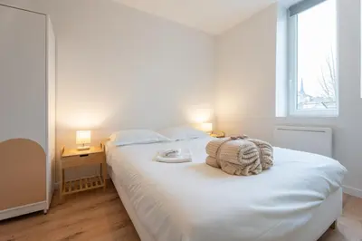 Un ou plusieurs lits dans un hébergement de l'établissement Le Maçon Park 1er Étage Appartement 4 Pers