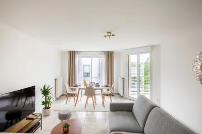Coin salon dans l'établissement Appartement lumineux 3 frontières parking gratuit