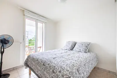 Un ou plusieurs lits dans un hébergement de l'établissement Appartement lumineux 3 frontières parking gratuit