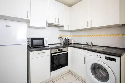 Cuisine ou kitchenette dans l'établissement Appartement lumineux 3 frontières parking gratuit