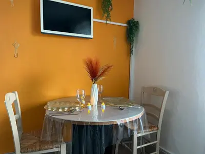 Télévision ou salle de divertissement dans l'établissement L'appart avec jardin