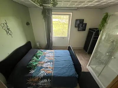 Un ou plusieurs lits dans un hébergement de l'établissement L'appart avec jardin