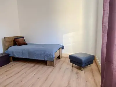 Un ou plusieurs lits dans un hébergement de l'établissement Les 2 suites de Belfort 184m2 Centre Parkings