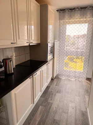 Cuisine ou kitchenette dans l'établissement Appartement le Fonki st louis centre