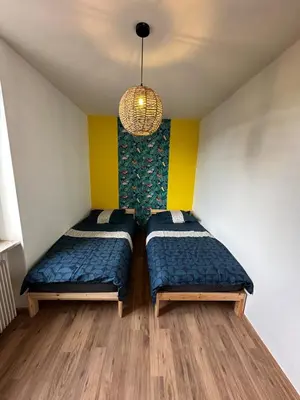 Un ou plusieurs lits dans un hébergement de l'établissement Bel appartement F4 dans une maisons 6 a personnes