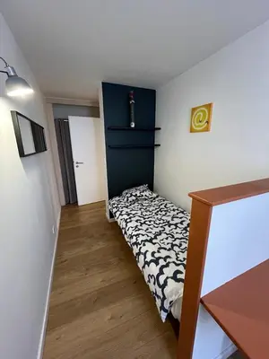 Un ou plusieurs lits dans un hébergement de l'établissement Superbe appartement atypique au cœur de Mulhouse
