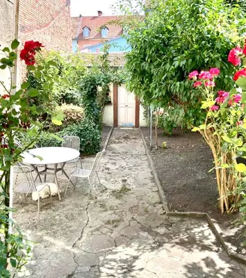 Jardin de l'établissement Superbe appartement atypique au cœur de Mulhouse