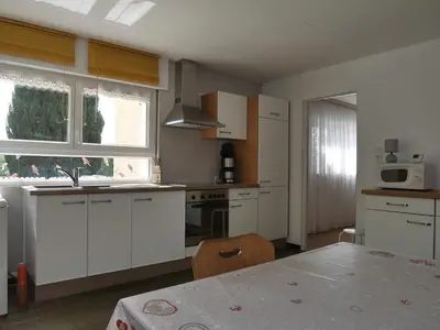 Cuisine ou kitchenette dans l'établissement les balcons de Fellering