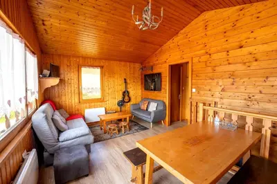 Coin salon dans l'établissement Chalet Paradis, panoramic view, garden & terrace