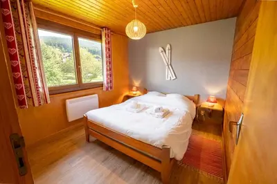 Un ou plusieurs lits dans un hébergement de l'établissement Chalet Paradis, panoramic view, garden & terrace