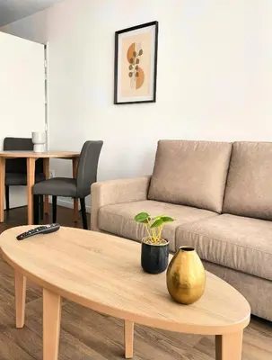 Coin salon dans l'établissement Zenao Appart'hôtels Wintzenheim
