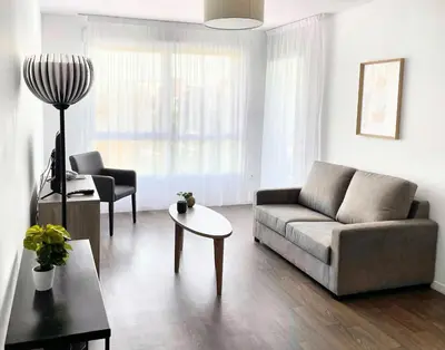 Coin salon dans l'établissement Zenao Appart'hôtels Wintzenheim