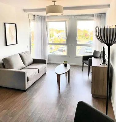 Coin salon dans l'établissement Zenao Appart'hôtels Wintzenheim