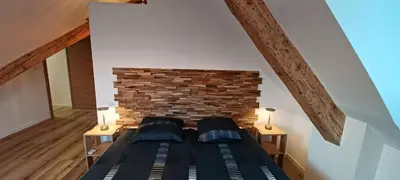 Un ou plusieurs lits dans un hébergement de l'établissement Spacieux, cosy et tout équipé pour un confort optimal