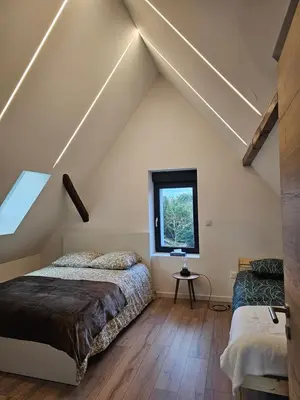 Un ou plusieurs lits dans un hébergement de l'établissement House La Belle Escapade