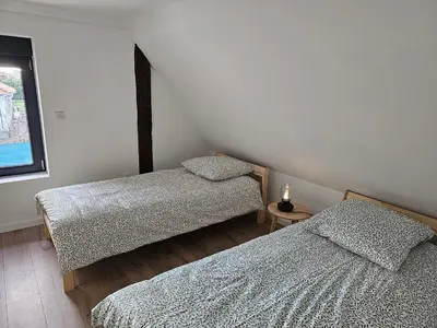 Un ou plusieurs lits dans un hébergement de l'établissement House La Belle Escapade