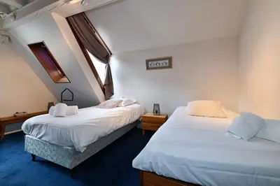 Un ou plusieurs lits dans un hébergement de l'établissement Manala - Maison Alsacienne avec Terrasse