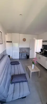 Coin salon dans l'établissement Magnifique studio meublé