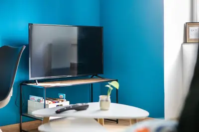 Télévision ou salle de divertissement dans l'établissement L'Échappée douce - Central, paisible et lumineux