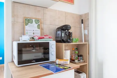 Cuisine ou kitchenette dans l'établissement L'Échappée douce - Central, paisible et lumineux