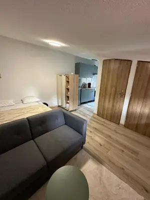 Coin salon dans l'établissement Three Borders Apartment