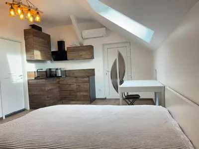 Un ou plusieurs lits dans un hébergement de l'établissement New appartement