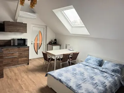 Un ou plusieurs lits dans un hébergement de l'établissement New appartement