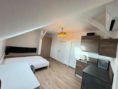 Un ou plusieurs lits dans un hébergement de l'établissement New appartement