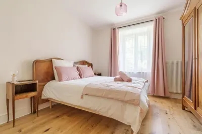 Un ou plusieurs lits dans un hébergement de l'établissement Gîte de l'Oriel - Gîte avec Grand Jardin