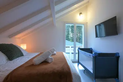 Un ou plusieurs lits dans un hébergement de l'établissement Chalet Vertpheny Spa & Terrasse à 500m du Lac de Gérardmer