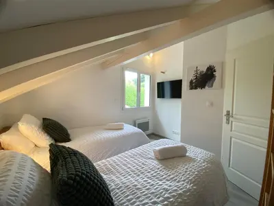 Un ou plusieurs lits dans un hébergement de l'établissement Chalet Vertpheny Spa & Terrasse à 500m du Lac de Gérardmer