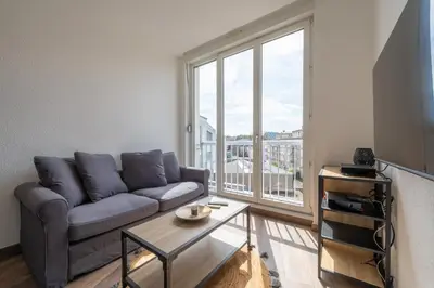 Coin salon dans l'établissement Le Bâle 24 Très Bel Appartement Centre Mulhouse