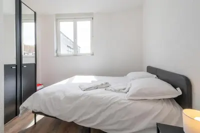 Un ou plusieurs lits dans un hébergement de l'établissement Le Bâle 24 Très Bel Appartement Centre Mulhouse