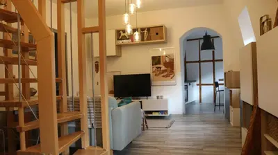Télévision ou salle de divertissement dans l'établissement Le duplex des Marchands